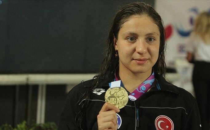 Milli y�z�c� Merve Tuncel'den g�m�� madalya!